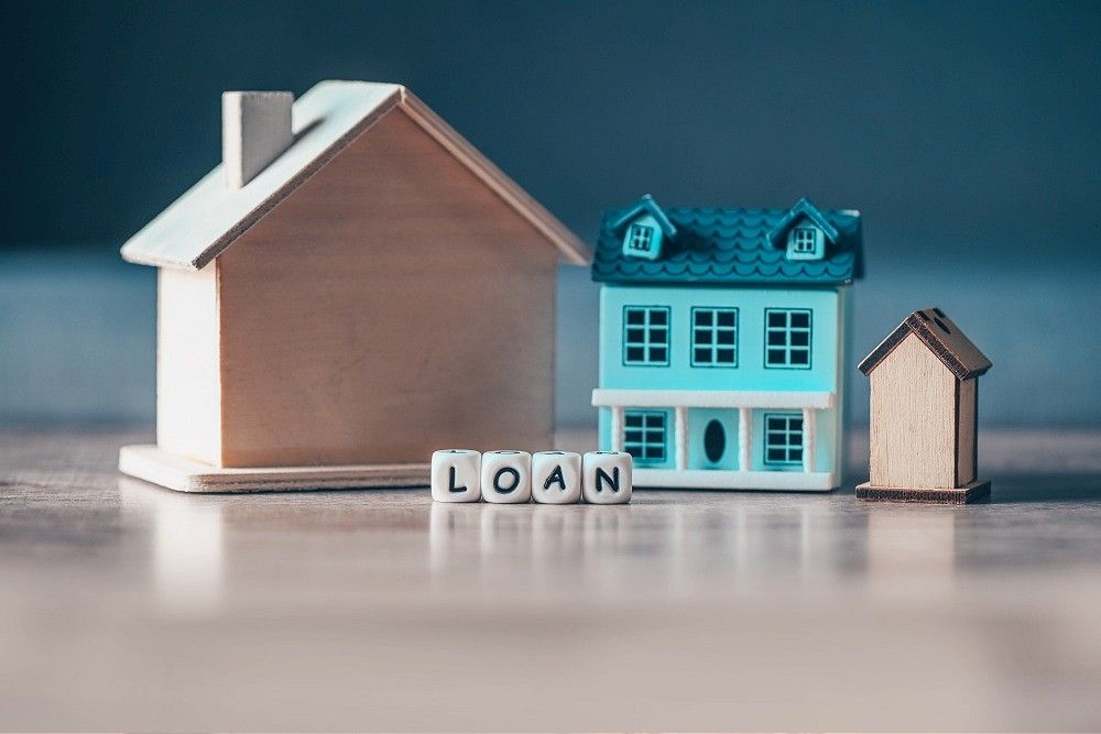 Home loan concept, Loan word on table with loan house model economy commercial real estate, Banks approve loans to buy homes business finance investments concept